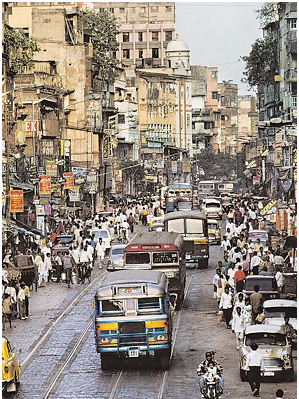 City street scene with crowded street and vehicles